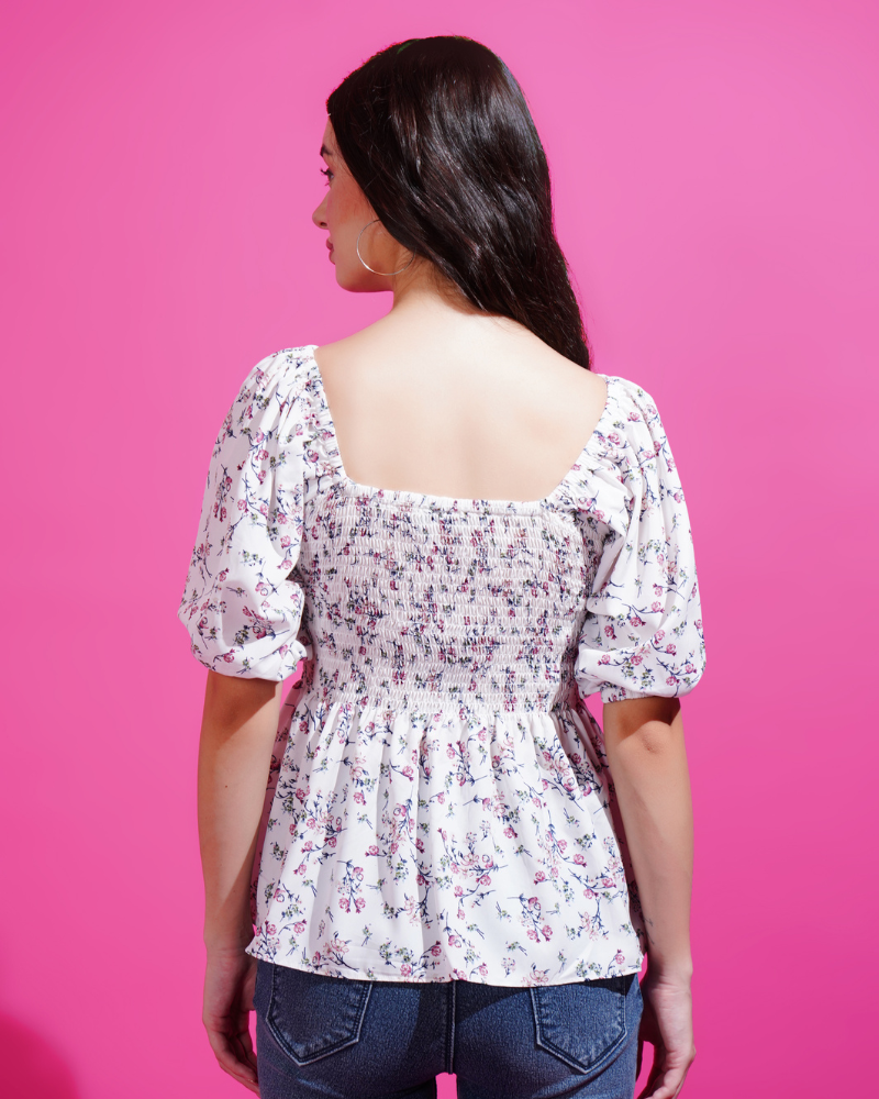 White flora smocked peplum elegance top