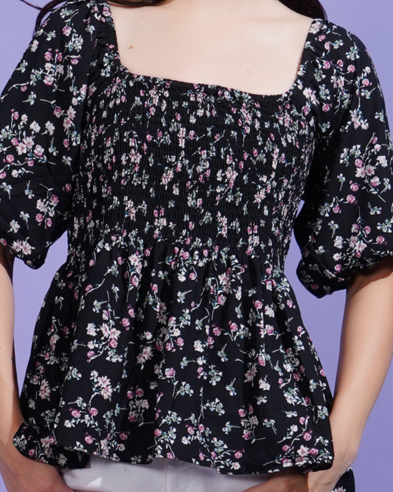 Black blossom smocked peplum stunner top